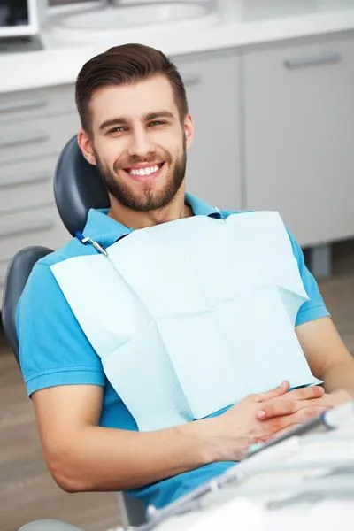 man smiling during his cosmetic dentistry procedure
